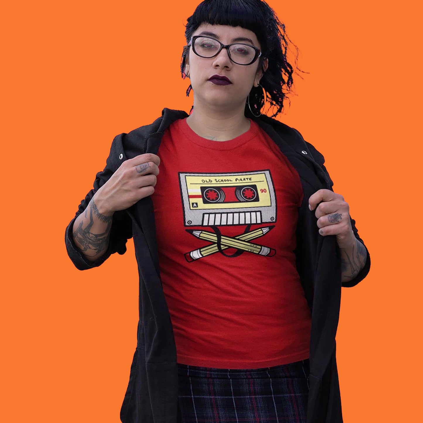 model wearing an old school pirate cassette tee in cherry red