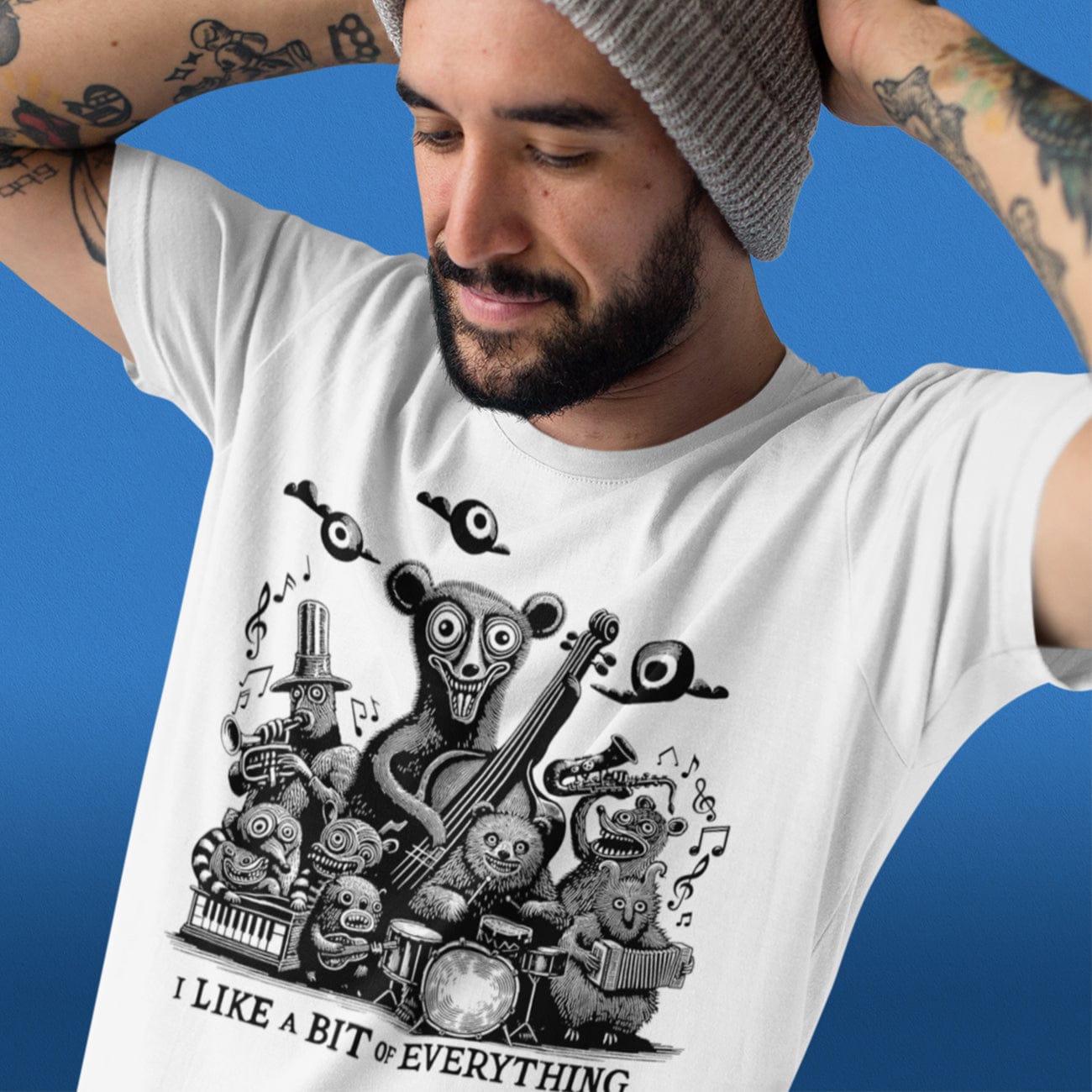 a close up view of a male model with his hands behind his head showing off a music t shirt on a blue background