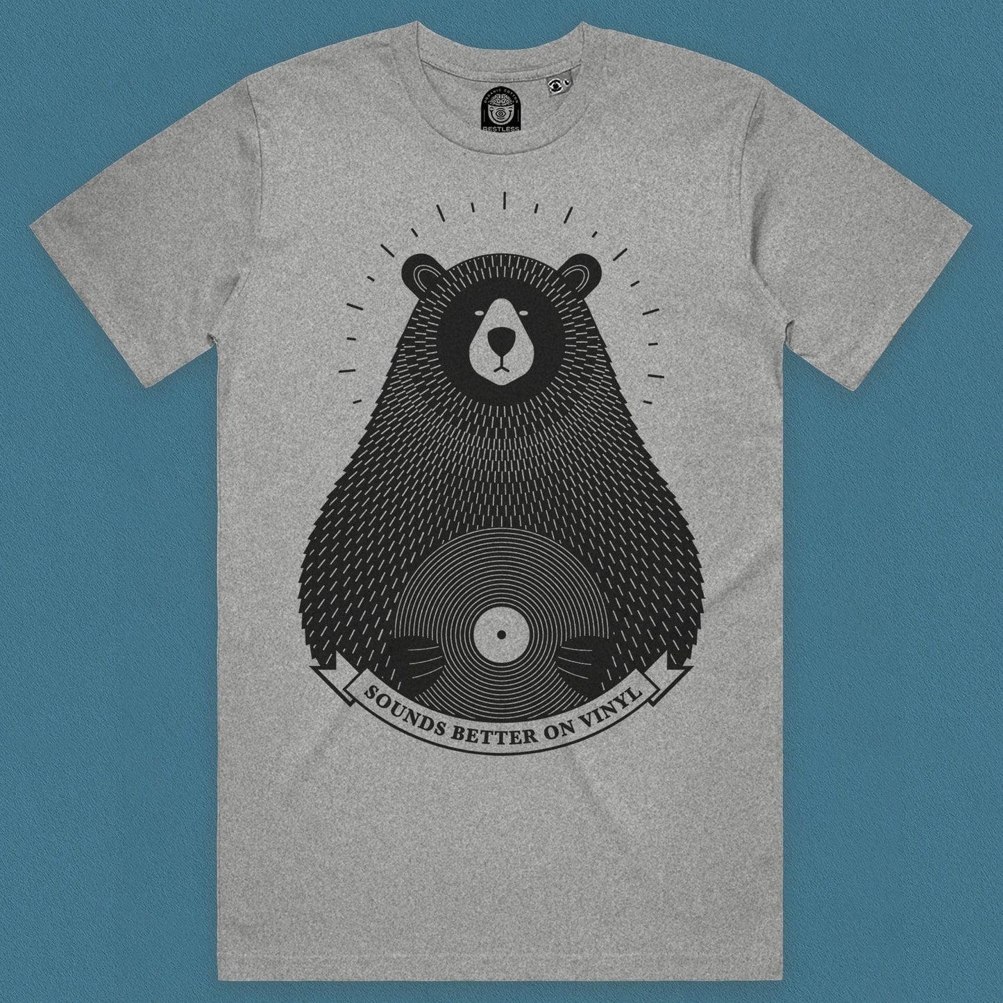 front view of the bear vinyl records t shirt featuring a bear on grey organic cotton with a light blue background