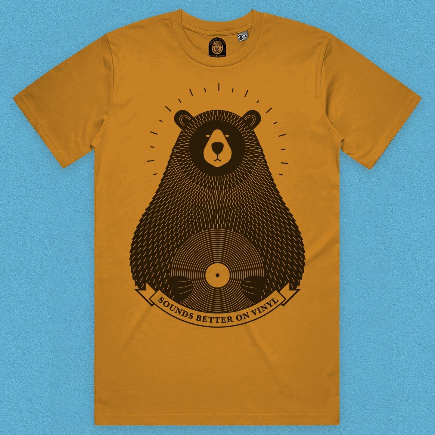 front view of a mustard tee with a vinyl record lover design on light background