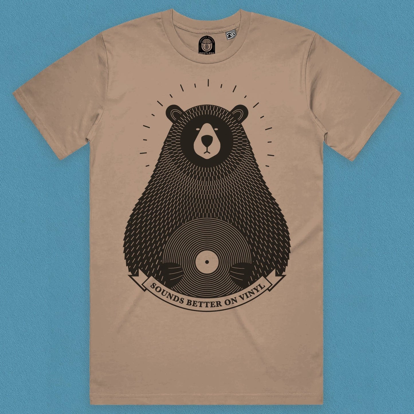 front view of a vinyl record t shirt featuring a bear on sand colour on organic cotton with a light blue background