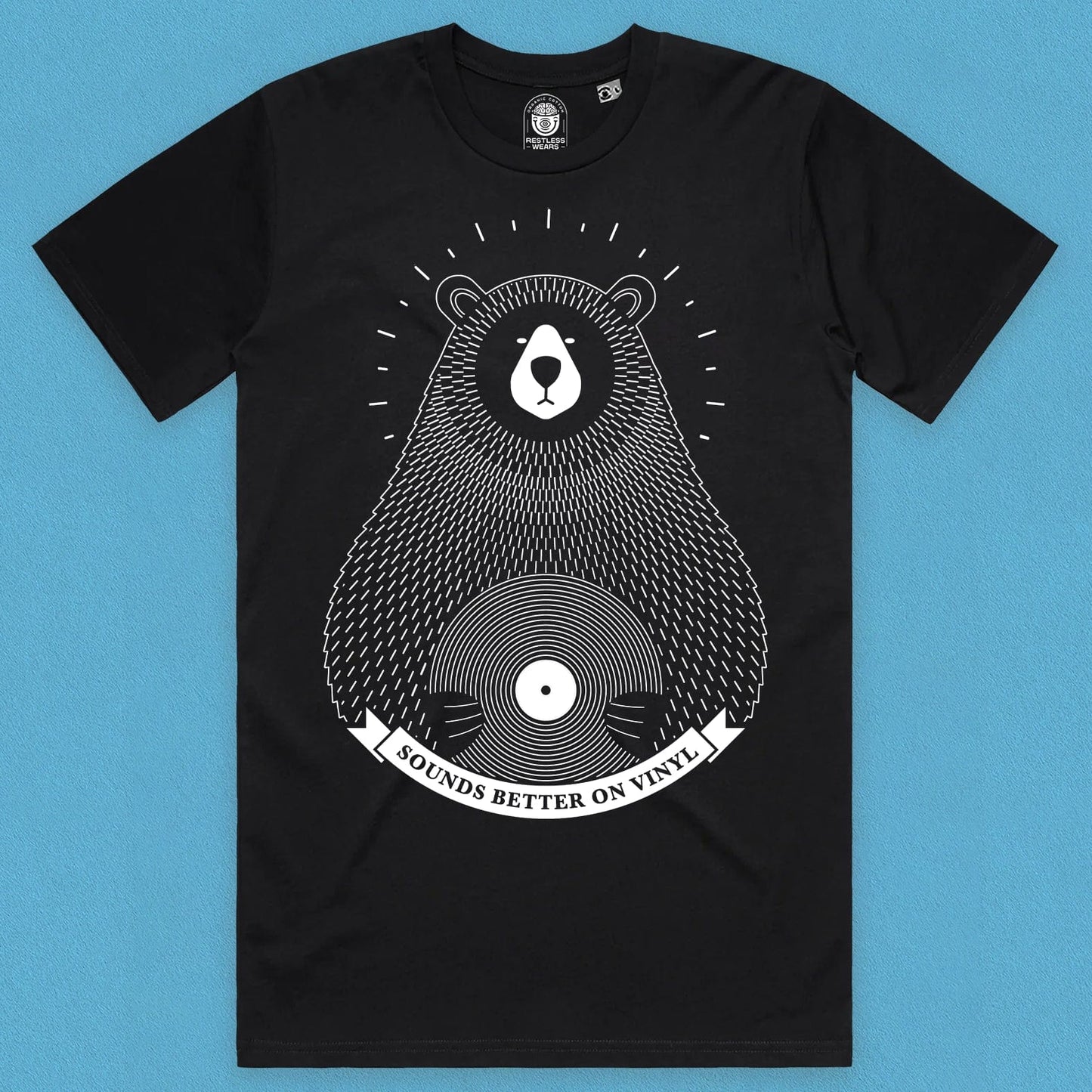 front view of a bear vinyl design t shirt on black organic cotton with a blue background