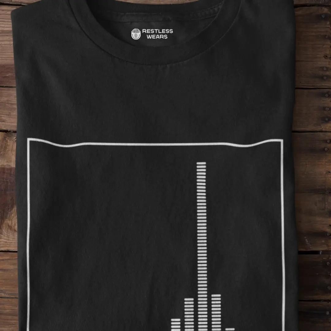folded-black-post-rock-t-shirt-showing-equaliser-graphic-on-wooden-surface

