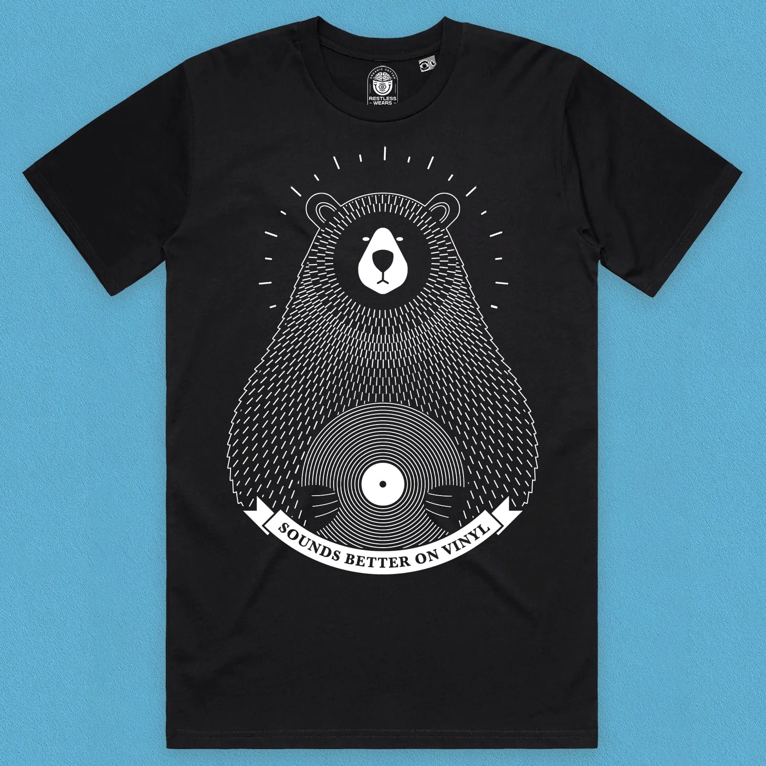 front view of a  bear vinyl design t shirt on black organic cotton with a blue background